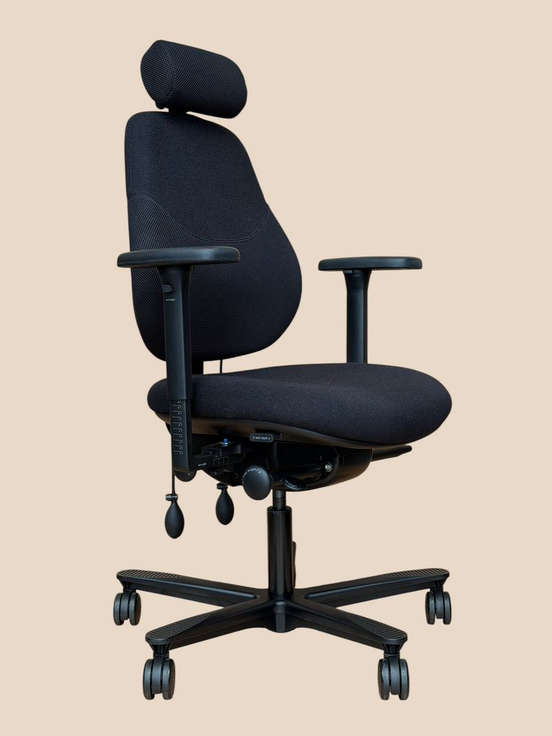 Refurbished Orangebox Flo black chair with headrest – front-left view