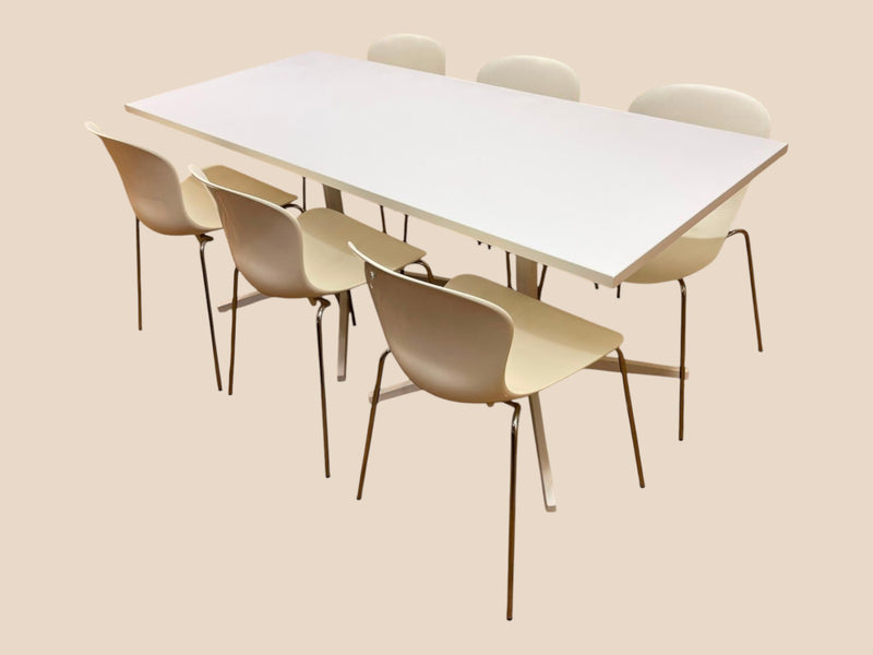 White meeting table with six cream Fritz Hansen NAP stacking chairs