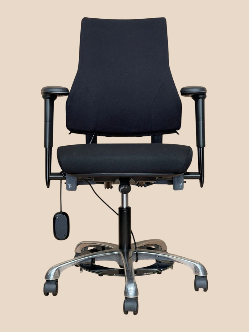 Refurbished Office Furniture BMA Axia 2.0 black ergonomic high-back chair with footring and adjustable armrests.
