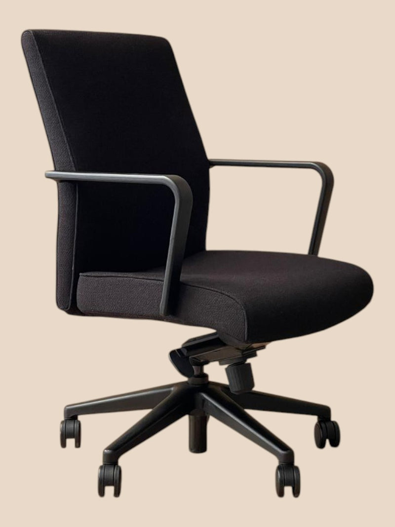 Refurbished Keilhauer Vanilla mid-back conference chair in black fabric with fixed arms, front angle