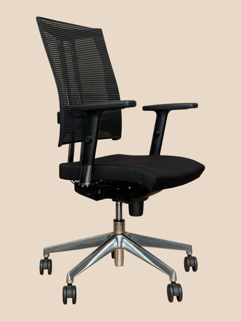 Refurbished Office Furniture Nowy Styl ergonomic office chair with black mesh back, fabric seat, and metal base.