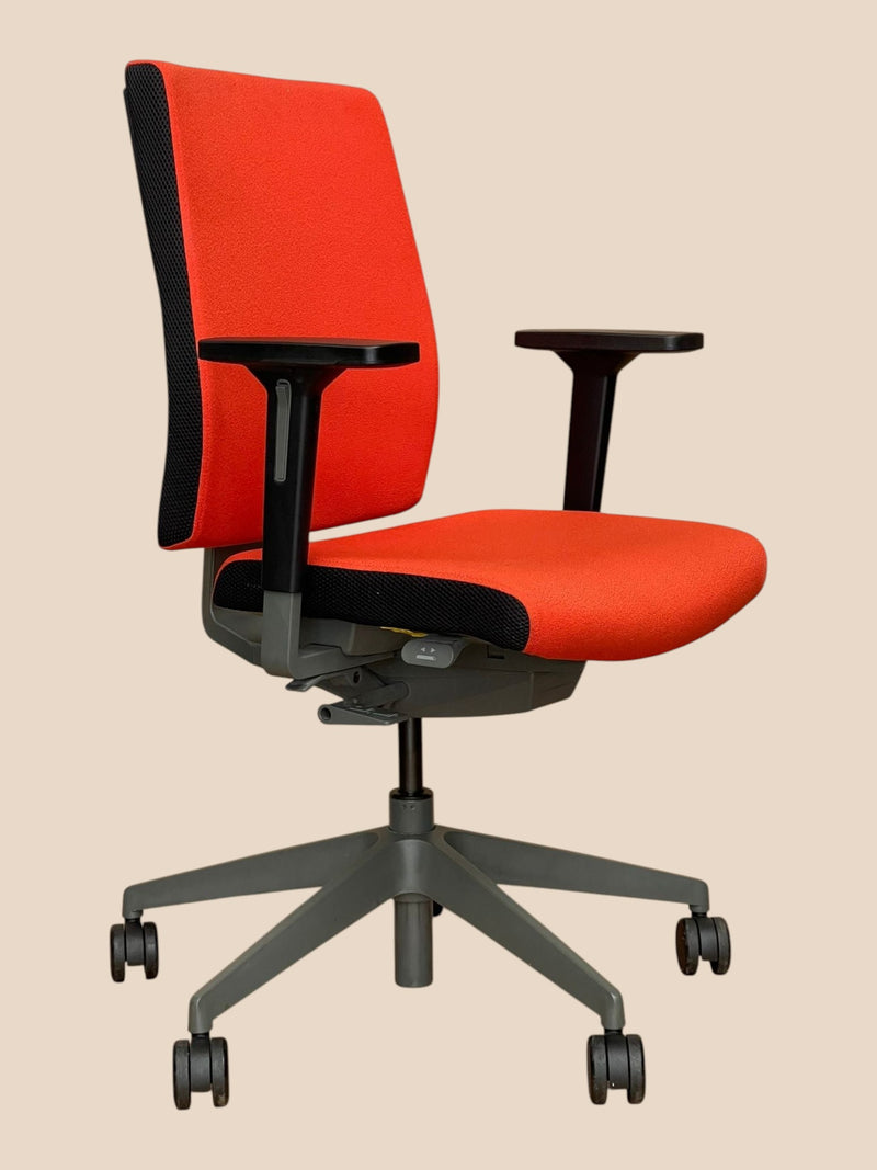 Refurbished Office Furniture Senator Freeflex ergonomic task chair in bright orange fabric with a dark grey frame.